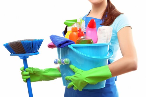 Cleaner working on a kitchen and bathroom domestic clean in Ruislip