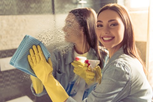 Local sofa cleaning technician treating a living room sofa